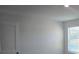 Bright bedroom with window and door, highlighting a peaceful retreat at 246 Crabapple Rd, Mcdonough, GA 30253