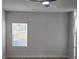 Bright bedroom featuring a modern ceiling fan and window views at 246 Crabapple Rd, Mcdonough, GA 30253