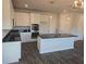 Modern kitchen boasting an island, stainless steel appliances, and dark wood flooring at 246 Crabapple Rd, Mcdonough, GA 30253