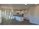 Sunlit kitchen featuring an island, stainless steel appliances, and open concept design at 246 Crabapple Rd, Mcdonough, GA 30253
