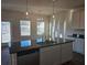 Open kitchen with a large island, granite countertop, and stainless steel dishwasher at 246 Crabapple Rd, Mcdonough, GA 30253