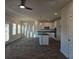 Open concept living area with hardwood floors flowing into the kitchen with granite island at 246 Crabapple Rd, Mcdonough, GA 30253