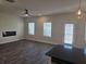 Spacious living room with hardwood floors, fireplace, and modern ceiling fan at 246 Crabapple Rd, Mcdonough, GA 30253