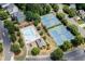 Aerial view of community pool, tennis courts and lush landscaping enhance neighborhood appeal at 3930 Suwanee Bend Dr, Suwanee, GA 30024