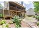 A spacious backyard with tiered deck and lush landscaping, ideal for entertaining and relaxation at 3930 Suwanee Bend Dr, Suwanee, GA 30024