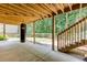 Covered patio with backyard access, adjacent to a grassy area with wooded views at 3930 Suwanee Bend Dr, Suwanee, GA 30024