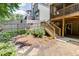 Backyard with a tiered deck, stone pathway, and lush greenery, perfect for outdoor enjoyment at 3930 Suwanee Bend Dr, Suwanee, GA 30024