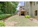 A lush green backyard surrounded by mature trees, providing a serene outdoor space at 3930 Suwanee Bend Dr, Suwanee, GA 30024