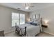 Bedroom featuring a metal bed frame, carpet, and window views at 3930 Suwanee Bend Dr, Suwanee, GA 30024