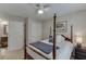 Bedroom with a four post bed, ceiling fan, and ensuite access at 3930 Suwanee Bend Dr, Suwanee, GA 30024