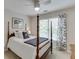 Bedroom featuring a four-poster bed, neutral carpet and curtains at 3930 Suwanee Bend Dr, Suwanee, GA 30024