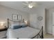 Bedroom featuring a metal bed frame, carpet, and a ceiling fan at 3930 Suwanee Bend Dr, Suwanee, GA 30024