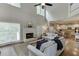 Bright living room features a fireplace, high ceilings, large windows and hardwood floors at 3930 Suwanee Bend Dr, Suwanee, GA 30024