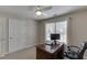 Office space with a desk, chair, large window, and carpet flooring at 3930 Suwanee Bend Dr, Suwanee, GA 30024