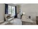 Well-lit home office featuring a comfortable chair and stylish desk at 3930 Suwanee Bend Dr, Suwanee, GA 30024