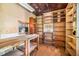 Large attic with shelving, storage, and a window view at 4624 Park Dr, Pine Lake, GA 30072