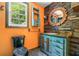 The bathroom features a vanity with drawers, decorative mirror, and a window view at 4624 Park Dr, Pine Lake, GA 30072
