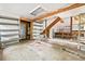 Spacious garage with a concrete floor, built in shelving, exposed beams, and access to storage at 4624 Park Dr, Pine Lake, GA 30072