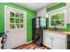 Charming kitchen with white cabinets, wood countertops, a copper sink, and black appliances at 4624 Park Dr, Pine Lake, GA 30072