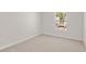 Cozy bedroom with neutral carpet, light walls, and a window at 6131 Knickerbocker St, Mableton, GA 30126