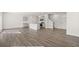 Open-concept living space with hardwood floors, kitchen island, and seamless flow for entertaining at 6131 Knickerbocker St, Mableton, GA 30126