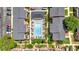 Overhead shot of the neighborhood pool and nearby buildings and car parking space in a well maintained area at 6520 Roswell Rd # 48, Atlanta, GA 30328