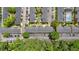 Aerial view of complex showing roof tops, parking spaces and trees creating a serene environment at 6520 Roswell Rd # 48, Atlanta, GA 30328