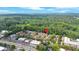 The aerial view highlights the property nestled amongst mature trees with nearby business, shopping and highways at 6520 Roswell Rd # 48, Atlanta, GA 30328
