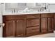 Bathroom vanity with double sinks, updated cabinetry, and vanity lighting at 6520 Roswell Rd # 48, Atlanta, GA 30328