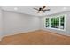 Bedroom with a ceiling fan, hardwood floors, neutral paint, and large windows at 6520 Roswell Rd # 48, Atlanta, GA 30328
