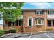 Charming brick townhome with black shutters, landscaping, and convenient parking at 6520 Roswell Rd # 48, Atlanta, GA 30328