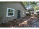 Exterior of the house with a small porch, door, and window at 1712 Evans Sw Dr, Atlanta, GA 30310