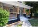Inviting front porch with ceiling fans, painted steps, and natural wood railing detail on a home with neutral siding at 1712 Evans Sw Dr, Atlanta, GA 30310