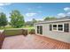 Back deck view highlights sliding glass door access and overlooks a grassy lawn with privacy fence at 1915 North Rd, Snellville, GA 30078