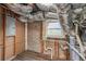 Unfinished basement with ductwork, exposed brick, and window at 1915 North Rd, Snellville, GA 30078