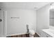 Modern bathroom features wood grain floors, neutral walls, and shower at 1915 North Rd, Snellville, GA 30078