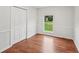 This bedroom has beadboard, natural light, and beautiful wood flooring at 1915 North Rd, Snellville, GA 30078