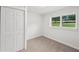 This bedroom has beadboard and natural light at 1915 North Rd, Snellville, GA 30078