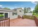 Large deck with wood railing overlooks backyard at 1915 North Rd, Snellville, GA 30078