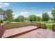 Wooden deck with green lawn in the background at 1915 North Rd, Snellville, GA 30078