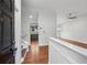Inviting entryway features hardwood floors, fresh paint, and views to the kitchen and dining area at 1915 North Rd, Snellville, GA 30078