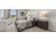 Bedroom featuring neutral walls, carpeted floors, a comfortable bed, and lots of natural light at 3038 Manor Hill Pl, Union City, GA 30291