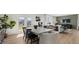 Open-concept dining area features a modern table, chairs, and an abundance of natural light from the nearby french doors at 3038 Manor Hill Pl, Union City, GA 30291