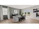 Dining area features a modern table, shiplap accent wall, and access to the backyard at 3038 Manor Hill Pl, Union City, GA 30291