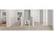 Hallway featuring neutral walls and carpeted floors with an open view to the bedroom and stairs at 3038 Manor Hill Pl, Union City, GA 30291