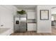 This kitchen features stainless steel appliances, white cabinets, and a framed print at 3038 Manor Hill Pl, Union City, GA 30291