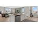 Stylish kitchen features a large island, stainless steel appliances, and open access to the living room at 3038 Manor Hill Pl, Union City, GA 30291