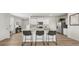 Open kitchen boasts a large island with seating, white cabinets, and stainless appliances at 3038 Manor Hill Pl, Union City, GA 30291