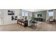 The inviting living room features a plank wall, modern furnishings, and a large window offering an abundance of natural light at 3038 Manor Hill Pl, Union City, GA 30291