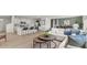 This is a comfortable living room with an open floor plan that is adjacent to the home's kitchen and dining area at 3038 Manor Hill Pl, Union City, GA 30291